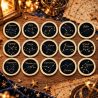 Les 15 pièces de collection du kit Voyage galactique, gravées de constellations, sur une table couverte d'étoiles dorées